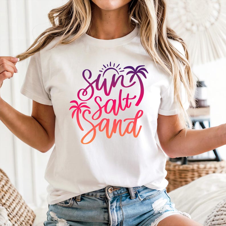 White resort wear tee with purple, pink, and orange, sun salt sand gradient, beach outfit.