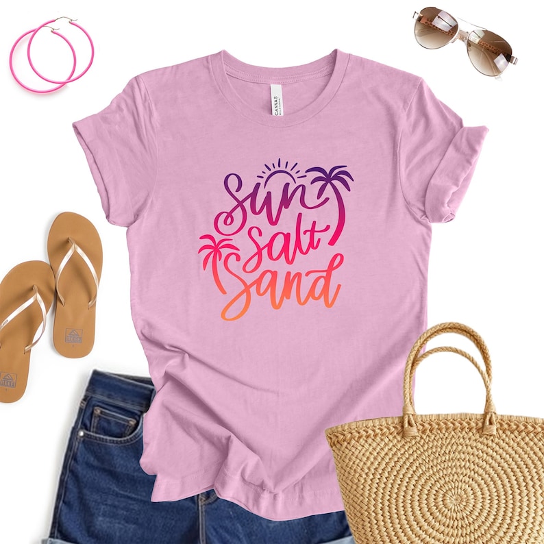 Ocean lover tee in Heather Bubble Gum color with sun salt sand script, makes a beachy vibe top.