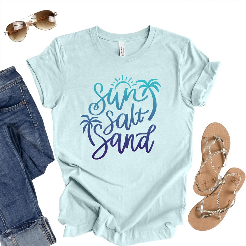 Heather Prism Ice Blue colored sun salt sand shirt cursive gradient lettering beach graphic tee.
