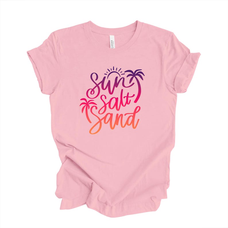 Pink vacation tee with sun salt sand script, is a relaxed fit shirt.
