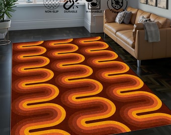 May include: A brown and orange area rug with a wavy, abstract pattern. The rug has a modern, retro design.