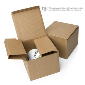 May include: A white ceramic mug with the text "Espresso" and a green leaf design. The mug is packaged in a brown cardboard box.