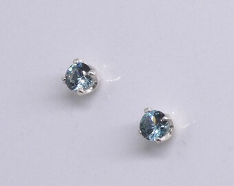 Blue Zircon (simulated) faceted 3 mm sterling silver stud earrings.