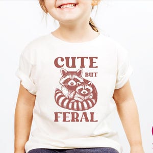 Cute But Feral Raccoon Toddler Shirt, Raccoon Lover Gift, Retro Feral Kid Tshirts, Trendy Raccoon Kids Tee, Cute Raccoon Lover Bodysuits, Boho Natural Kids Toddler Youth Tee, Sarcastic Snark Racoon Shirt, Funny Quote Women's Tee, Christmas Raccoon