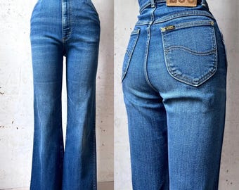 Jeansy Lee Riders Boot Cut z lat 70. i 80. z przetarciami na dole, sprane, rozmiar 27” w pasie, 28” w nogawce, rozmiar S, wyprodukowano w USA