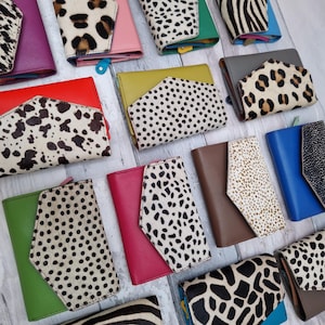 May include: A set of three ceramic mugs with a speckled, matte finish in cream, light brown, and dark brown. Each mug has a simple, minimalist design, ideal for tea or coffee.