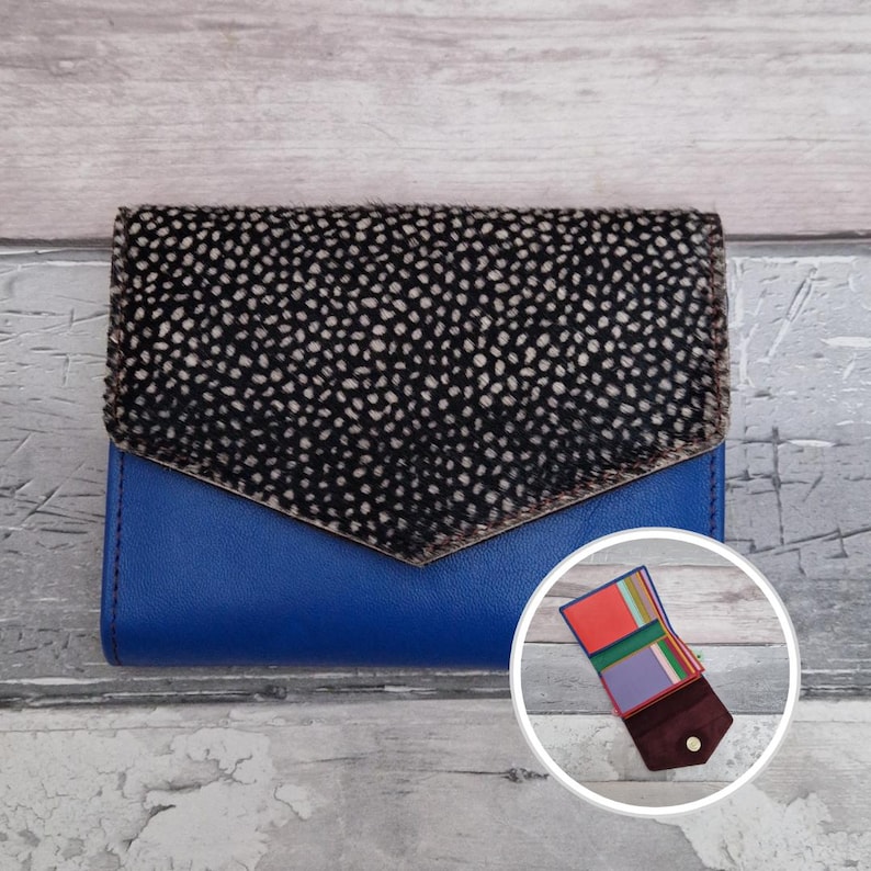 May include: A trio of ceramic mugs with a speckled, matte finish in light blue, cream, and grey. The mugs have a simple, modern design and a comfortable handle, perfect for tea or coffee.