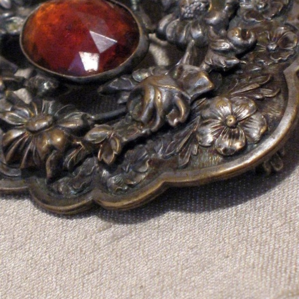 Brass\/sterling plated Victorian floral brooch with amber glass detail