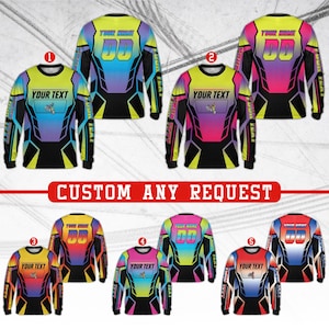 May include: A collection of six long-sleeved motocross jerseys with customizable text and numbers. The jerseys feature vibrant gradient color schemes, including blue, pink, yellow, and black accents. The phrase "CUSTOM ANY REQUEST" is displayed in red.