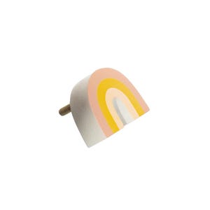 May include: A rainbow-shaped wooden knob with a pink, yellow, and white design. The knob has a screw on the back for attaching to a drawer or door.