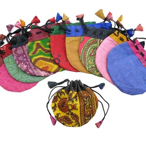 May include: A set of 11 colorful drawstring pouches with floral patterns. The pouches are made of fabric and have tassels.
