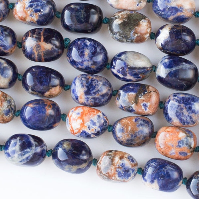 One 16 inch strand of 12x16mm Orange and Blue Sodalite polished free-form beads like little sodalite potatoes