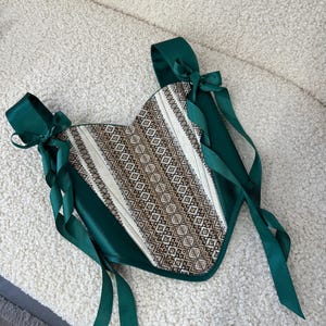 Corset with ornament is an exquisite combination of elegant design and incredible embroidery. Designed to make every outfit look unique and