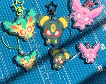 PKMN Pocket Monster Eeveelutions Acrylic Charms 2.5" and phone charms 1.5"! Sylveon, umbreon, leafeon