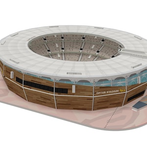 May include: A model of Optus Stadium, a large, modern stadium with a white roof and wooden exterior. The stadium is surrounded by a brown, textured base.