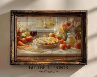 Puede incluir: Pintura enmarcada de naturaleza muerta que representa una mesa con tarta, manzanas, zanahorias, copas de vino y una jarra de zumo. La pintura tiene una paleta de colores cálidos, con una ventana al fondo. El texto "BLUEBELL PRINTS Art Collective" está en la parte inferior.