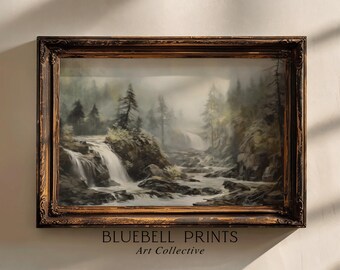 May include: A framed landscape painting depicting a waterfall cascading into a river, surrounded by trees and rocks. The artwork is in a dark, ornate wooden frame. The text "BLUEBELL PRINTS Art Collective" is at the bottom.