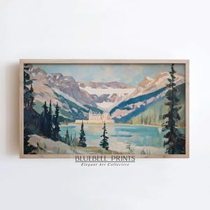 May include: A framed landscape painting depicting a mountain range, lake, and a building. The artwork features a color palette of blues, greens, and whites. The text "BLUEBELL PRINTS Elegant Art Collective" is visible at the bottom.