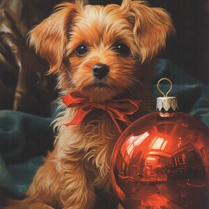 May include: A small, fluffy, tan-colored dog with a red bow sits next to a large, shiny red Christmas ornament. The ornament reflects the interior of a room. The dog has dark eyes and perky ears.