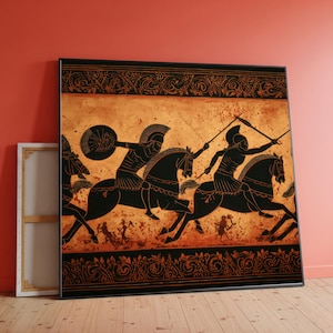 May include: A framed artwork depicting a classical scene of warriors on horseback. The black figures are set against a tan background with decorative borders. The artwork is leaning against a red wall.