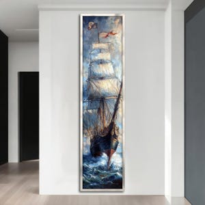 Può includere: Un dipinto di una grande nave a vela con vele bianche contro un cielo blu e l'oceano. La nave sta navigando verso lo spettatore con il bompresso e la figura di prua visibili. Il dipinto è incorniciato in una cornice argentata.