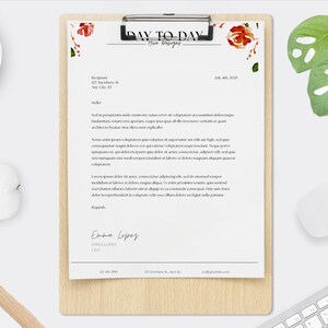 May include: A white letterhead with a floral design in the top right corner. The text "DAY TO DAY" is in black and centered at the top of the page. The text "Fine Designs" is in black and centered below "DAY TO DAY". The text "July 4th, 2023" is in black and aligned to the right. The text "Recipient" is in black and aligned to the left. The text "123 Anystreet St." is in black and aligned to the left. The text "Any City, ST" is in black and aligned to the left. The text "Hello" is in black and aligned to the left. The text "Sed ut perspiciatis unde omnis iste natus error sit voluptatem accusantium doloremque laudantium, totam rem aperiam, eaque ipsa quae ab illo inventore veritatis et quasi architecto beatae vitae dicta sunt explicabo." is in black and aligned to the left. The text "Nemo enim ipsam voluptatem quia voluptas sit aspernatur aut odit aut fugit, sed quia consequuntur magni dolores eos qui ratione voluptatem sequi nesciunt. Neque porro quisquam est, qui dolorem ipsum quia dolor sit amet, consectetur, adipisci velit, sed quia non numquam eius modi tempora incidunt ut labore et dolore magnam aliquam quaerat voluptatem." is in black and aligned to the left. The text "Lorem ipsum dolor sit amet, consectetur adipiscing elit, sed do eiusmod tempor incididunt ut labore et dolore magna aliqua. Ut enim ad minim veniam, quis nostrud exercitation ullamco laboris nisi ut aliquip ex ea commodo consequat. Duis aute irure dolor in reprehenderit in voluptate velit esse cillum dolore eu fugiat nulla pariatur." is in black and aligned to the left. The text "Regards" is in black and aligned to the left. The text "Emma Lopez" is in black and aligned to the left. The text "EMMA LOPEZ" is in black and aligned to the left. The text "CEO" is in black and aligned to the left. The text "123.456.7890" is in black and aligned to the left. The text "123 Anystreet St., Any City, ST" is in black and aligned to the left. The text "email@provider.com" is in black and aligned to the right.