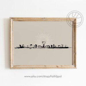 Pode incluir: Uma impressão emoldurada com fundo bege e uma ilustração em preto e branco de uma mesa com um cálice e pão. A ilustração é estilizada e tem um raio de sol atrás do cálice. O texto "www.etsy.com/shop/FaithSpot" está na parte inferior da impressão.