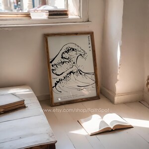 May include: A black and white print of a wave with the text "Faith is..." and a quote about the "passing sun" and "the wide mouth of the ocean".