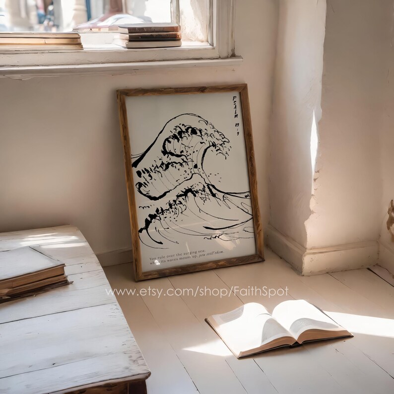 May include: A black and white print of a wave with the text "Faith is..." and a quote about the "passing sun" and "the wide mouth of the ocean".