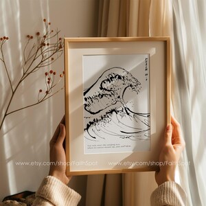 May include: A framed black and white print of a wave with the text "You rule over the roaring sea, when its waves mount up, you still calm them." and "Psalm 93:4" printed below the wave.