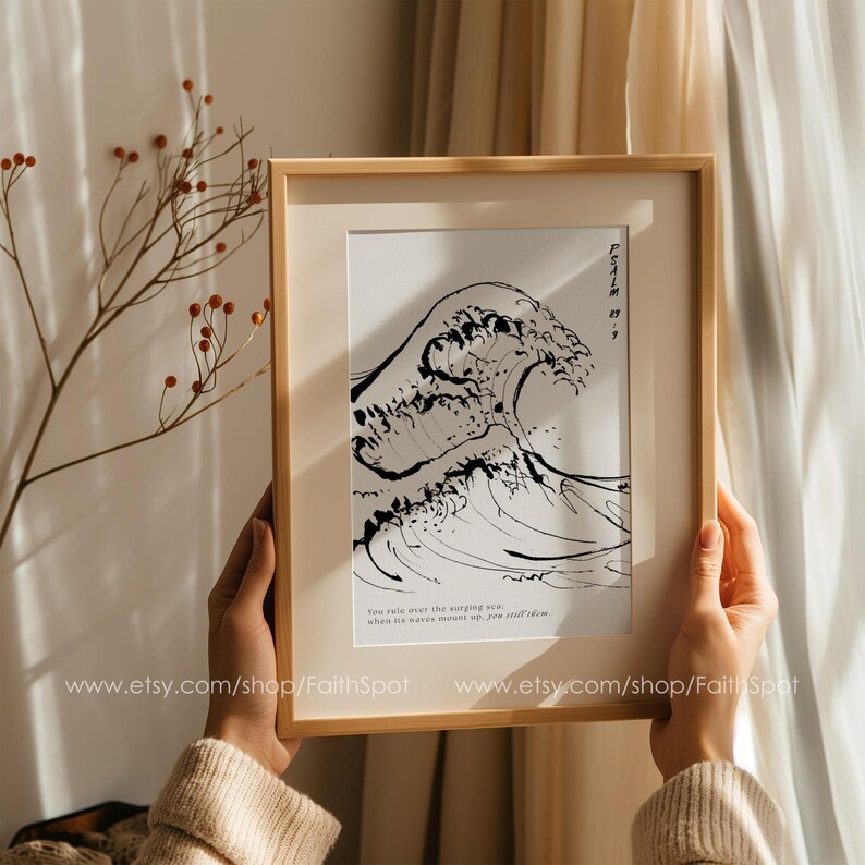 May include: A framed black and white print of a wave with the text "You rule over the roaring sea, when its waves mount up, you still calm them." and "Psalm 93:4" printed below the wave.
