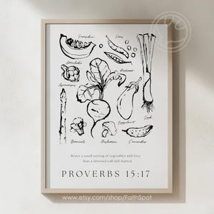 Peut inclure: Une affiche encadrée en noir et blanc avec des illustrations de légumes, dont citrouille, petits pois, artichaut, asperges, brocoli, betterave, aubergine, champignon et concombre. Le texte "PROVERBES 15:17" et une citation sur l'amour et les légumes sont inclus.