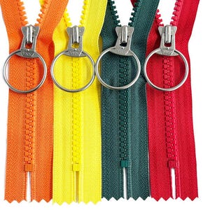 May include: Four different colored zipper pulls with silver sliders. The zippers are orange, yellow, green, and red.