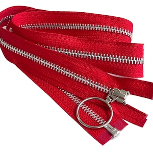 May include: Red zipper with silver teeth and a ring pull. The zipper is folded in half and the pull is at the center.