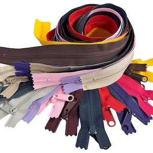 May include: A collection of colorful zippers in various shades, including yellow, brown, pink, purple, and navy. The zippers are arranged in a spiral, with some extended and others closed. The image is set against a white background.