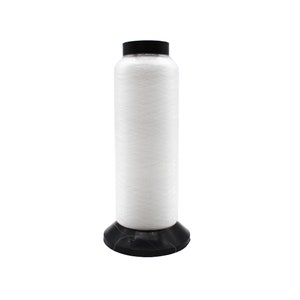 May include: A white spool of thread with a black plastic base.