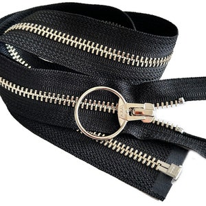 May include: Black zipper tape with silver metal teeth and a silver pull tab. The zipper is folded in half and the pull tab is at the center.