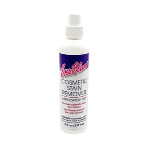 May include: A white plastic bottle with a pink and purple label that reads "Ever Bloom Cosmetic Stain Remover Applicator Top Removes cosmetic stains from fabrics. Now! More powerful, low-odor formula. WARNING! Combustible liquid. Keep out of reach of children. See back panel for additional information. 8 fl. oz (237 ml)"