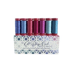 May include: A set of seven small spools of cotton thread in shades of blue, pink, and purple. The spools are labelled "At Day's End" by Sarah Maxwell. 100% cotton, 7 small spools, 12wt (56 yds ea).
