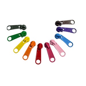 May include: Assortment of ten zipper pulls in various colors, including black, green, yellow, orange, red, blue, pink, and purple. Each pull has the word "YKK" printed on it.