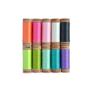 May include: A set of ten spools of thread in various colors, including orange, pink, light pink, white, black, lime green, green, light blue, turquoise, and purple. Each spool is labeled "Aurifil" and "Made in Italy".