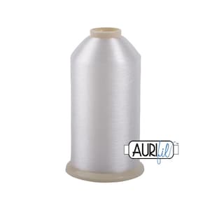May include: A spool of white thread with a clear plastic container and a white label that says "Aurifil" in blue.