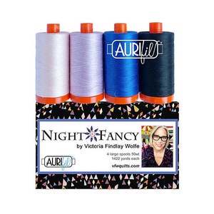 May include: A set of four 50wt Aurifil thread spools in white, lavender, blue, and black. The spools are labeled "NIGHT FANCY by Victoria Findlay Wolfe" and "Aurifil".