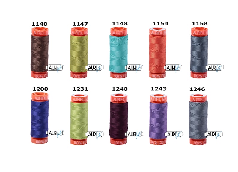 May include: A set of ten spools of Aurifil thread in various colours, including brown, green, blue, red, grey, purple, and teal. Each spool is labelled with the Aurifil logo and the thread number.