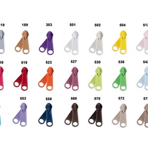May include: Assortment of 22 zipper pulls in various colors, including purple, red, orange, yellow, green, blue, brown, and gray. Each pull has a number printed on it.