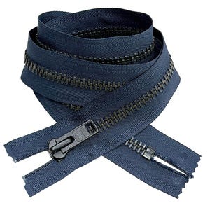 May include: A coiled navy blue zipper featuring dark metallic teeth and a black slider pull. The fabric tape is a deep blue color, and the zipper is arranged in a circular loop with the ends extending outward at the bottom of the composition.
