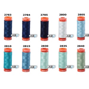 May include: A collection of ten spools of Aurifil thread in various shades of blue, green, and white. The spools are labeled with their corresponding numbers: 2783, 2784, 2785, 2800, 2805, 2810, 2815, 2830, 2835, and 2840.