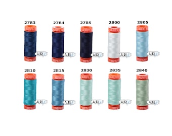 May include: A collection of ten spools of Aurifil thread in various shades of blue, green, and white. The spools are labeled with their corresponding numbers: 2783, 2784, 2785, 2800, 2805, 2810, 2815, 2830, 2835, and 2840.