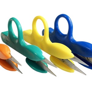 May include: Four pairs of fingertip scissors in orange, green, yellow, and blue. The scissors have a ring handle for easy use.