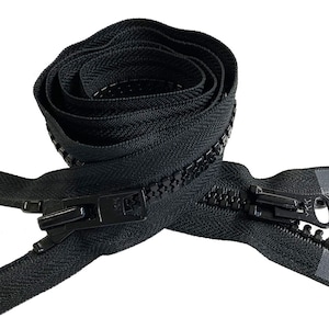 May include: Black zipper with a black slider and a black pull tab. The zipper is coiled and ready to be sewn into a garment.